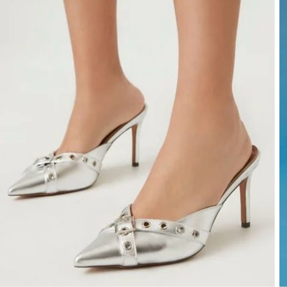 Brand new, never worn. Silver metallic pointy toe heels. So cute! Size 7.
